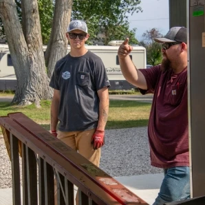 Two team members working outside together.