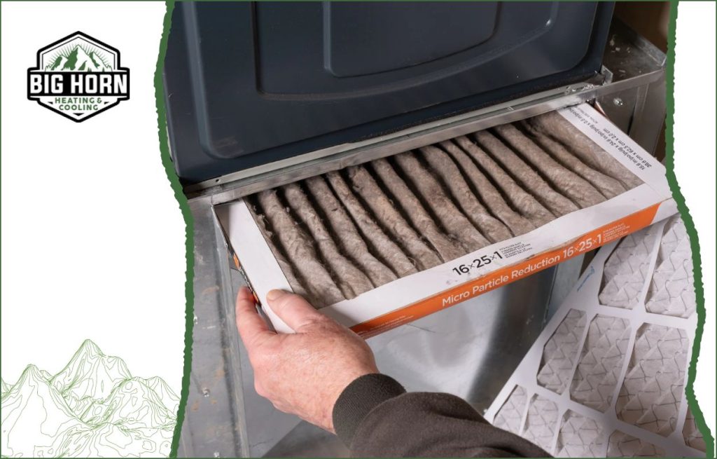 Changing a furnace filter.
