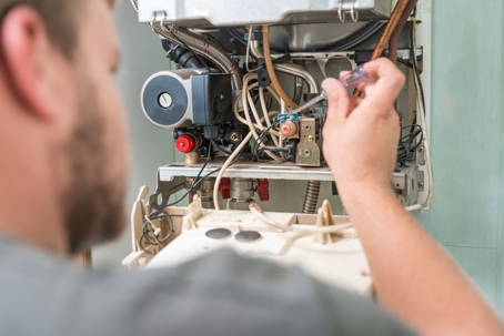 Man Fixing Furnace